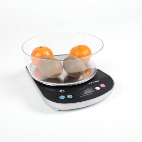 Balance parlante indiquant le poids de deux oranges et de deux kiwis