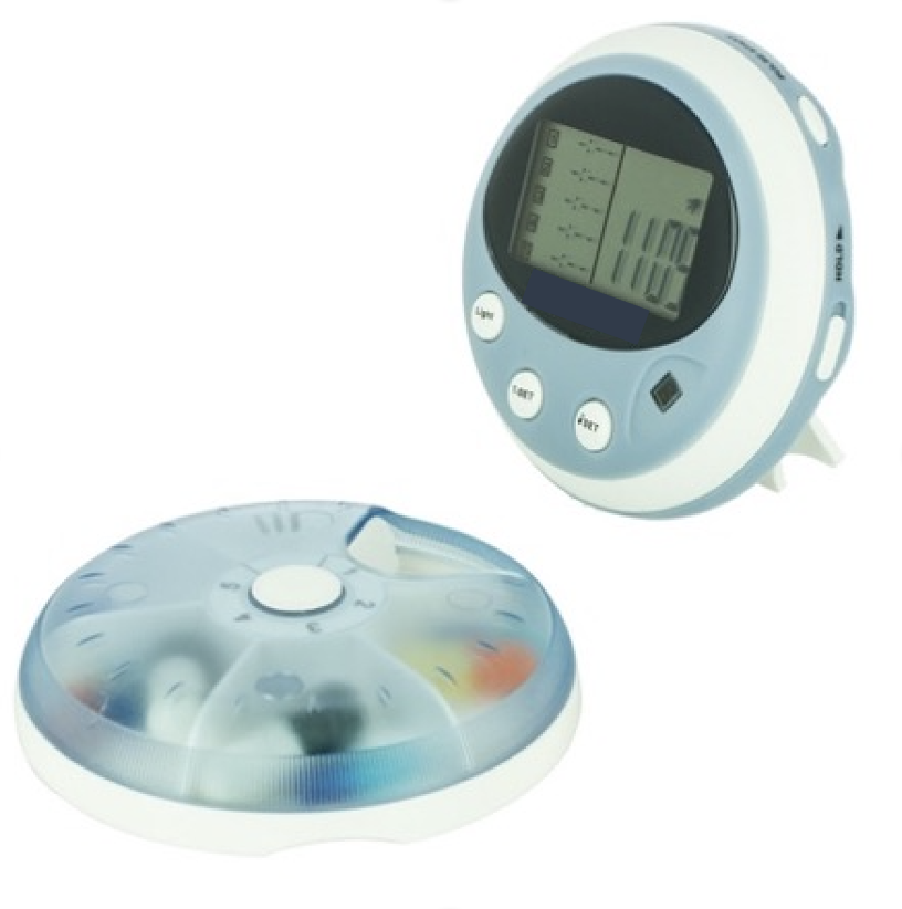 Boitier rond à 6 cases pour médicaments et équipé d'un écran avec système de rappel; de taille de la paume de la main