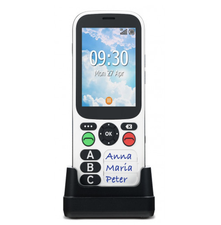 Téléphone portable sur socle de recharge. Écran, 3 touches mémoire pour appels, touche verte pour décrocher, touche rouge pour raccrocher et 3 autres touches pour accès aux fonctionnalités.